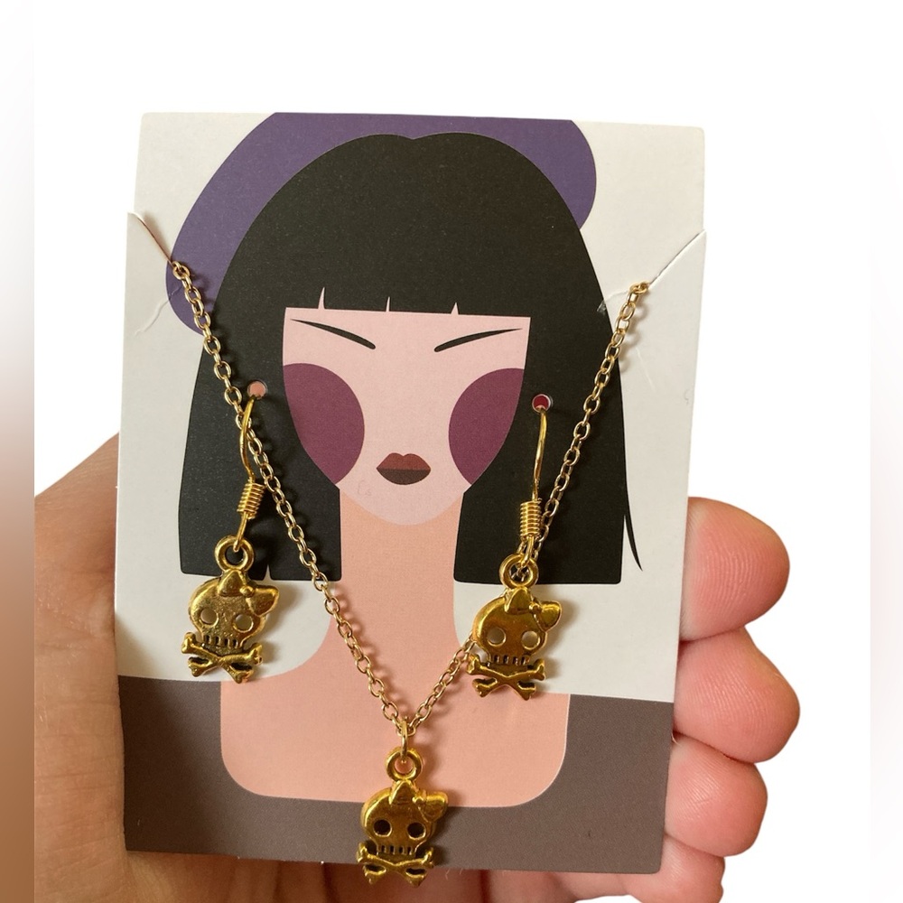 Gold skull with bow jewelry set